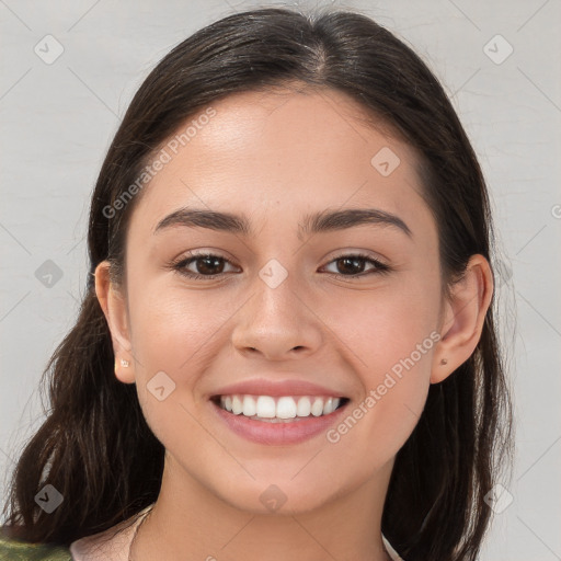 Joyful white young-adult female with long  brown hair and brown eyes