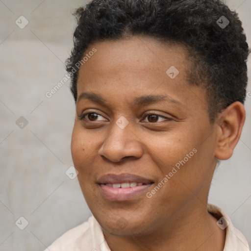 Joyful black young-adult female with short  brown hair and brown eyes