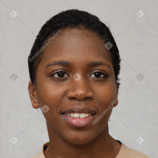 Joyful black young-adult female with short  black hair and brown eyes