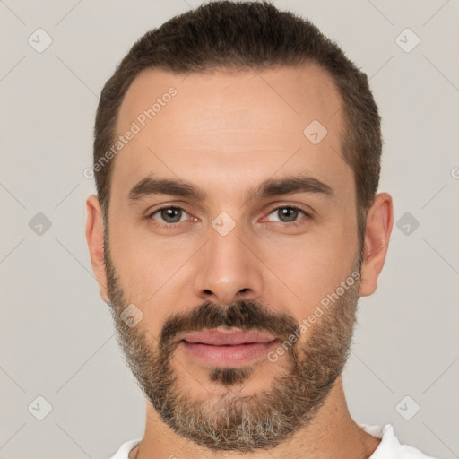 Joyful white adult male with short  brown hair and brown eyes