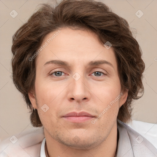 Joyful white adult male with short  brown hair and grey eyes