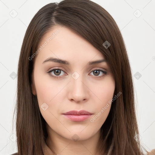 Neutral white young-adult female with long  brown hair and brown eyes