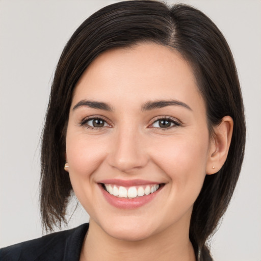 Joyful white young-adult female with medium  brown hair and brown eyes