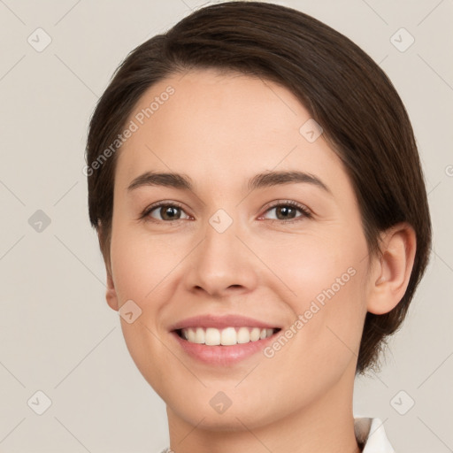 Joyful white young-adult female with short  brown hair and brown eyes