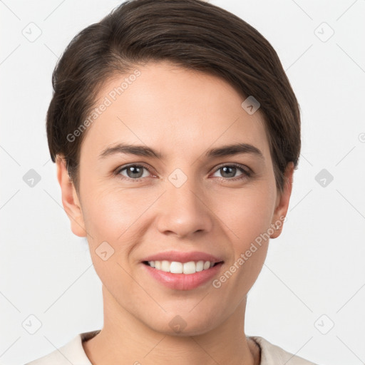 Joyful white young-adult female with short  brown hair and brown eyes