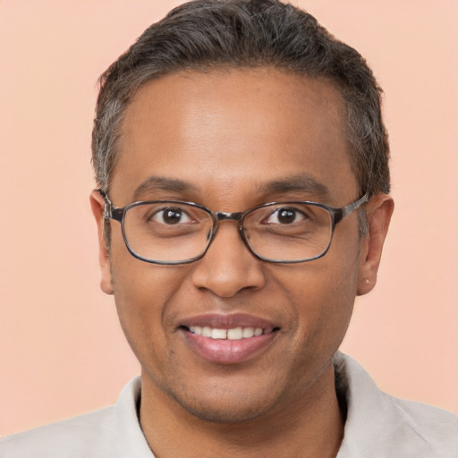 Joyful white adult male with short  brown hair and brown eyes