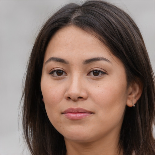 Joyful white young-adult female with long  brown hair and brown eyes