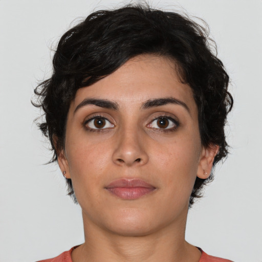 Neutral white young-adult female with short  brown hair and brown eyes