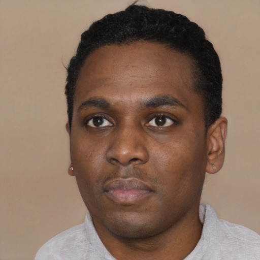 Neutral black young-adult male with short  black hair and brown eyes