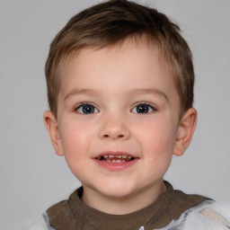 Joyful white child male with short  brown hair and brown eyes