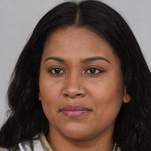 Joyful asian adult female with long  brown hair and brown eyes