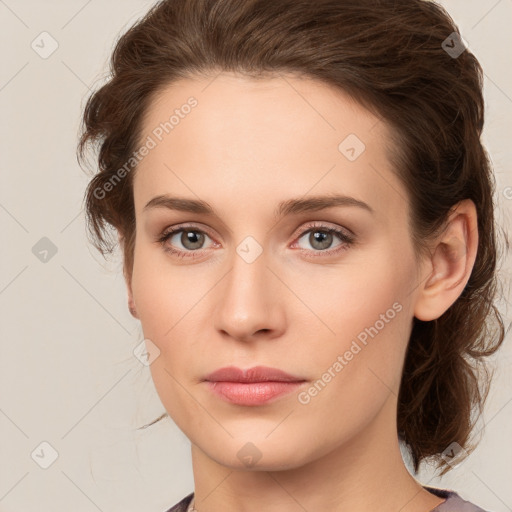 Joyful white young-adult female with medium  brown hair and green eyes