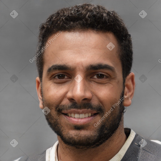 Joyful white young-adult male with short  black hair and brown eyes