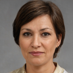 Joyful white adult female with medium  brown hair and brown eyes