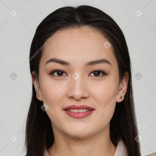 Joyful asian young-adult female with long  brown hair and brown eyes