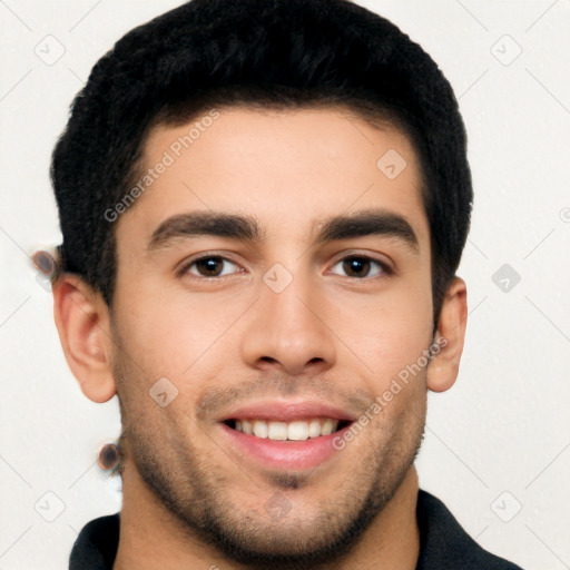 Joyful white young-adult male with short  black hair and brown eyes