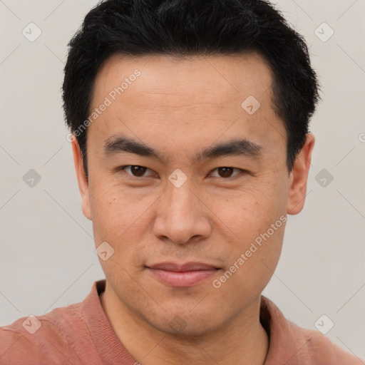 Joyful latino young-adult male with short  brown hair and brown eyes