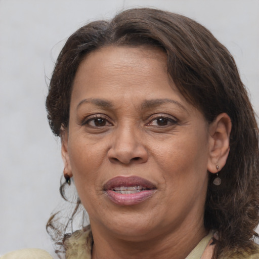 Joyful white adult female with medium  brown hair and brown eyes