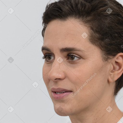 Joyful white adult female with short  brown hair and brown eyes