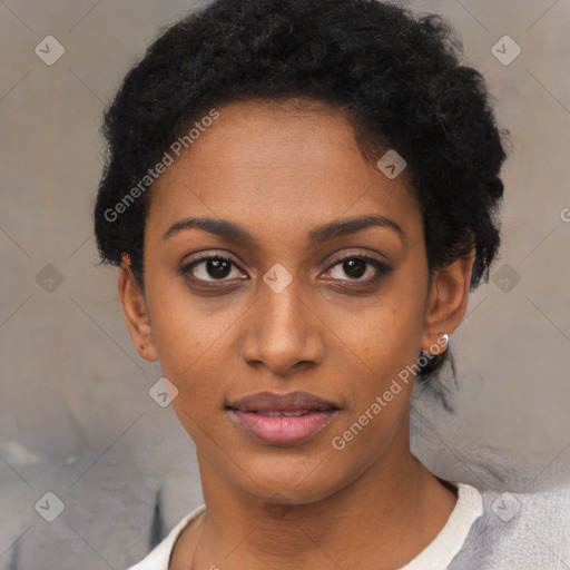 Joyful black young-adult female with short  black hair and brown eyes