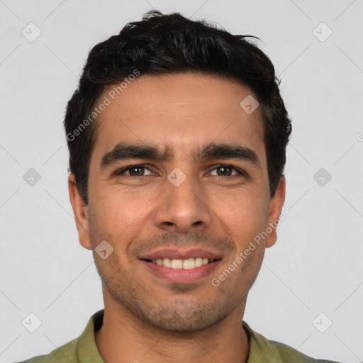 Joyful white young-adult male with short  black hair and brown eyes