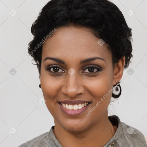 Joyful black young-adult female with short  black hair and brown eyes