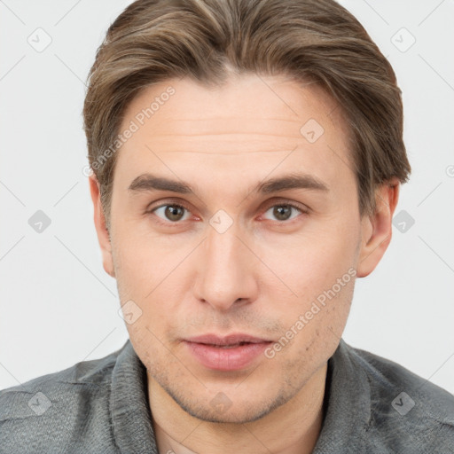 Neutral white young-adult male with short  brown hair and brown eyes