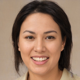 Joyful white young-adult female with medium  brown hair and brown eyes