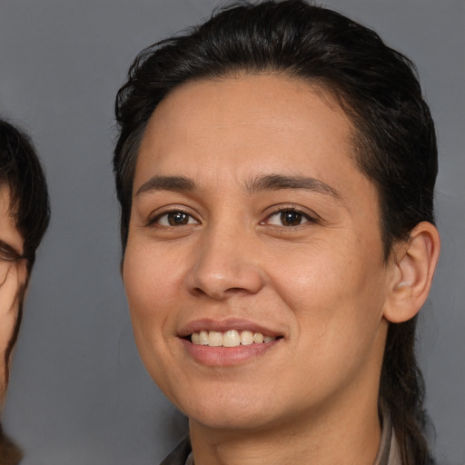 Joyful white young-adult female with medium  brown hair and brown eyes