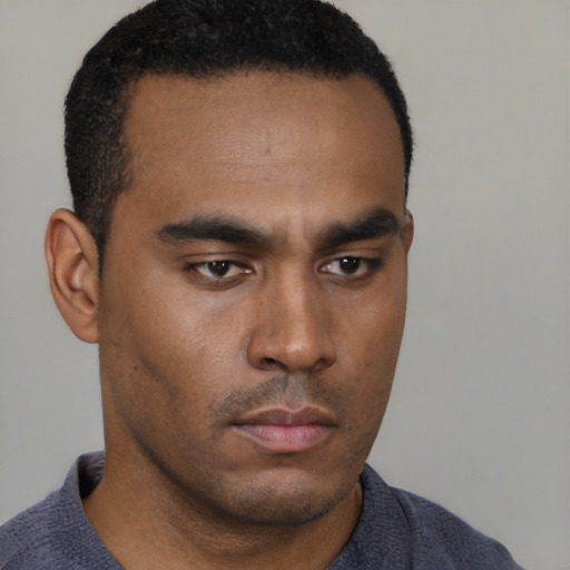Neutral latino young-adult male with short  brown hair and brown eyes