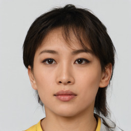 Neutral asian young-adult female with medium  brown hair and brown eyes