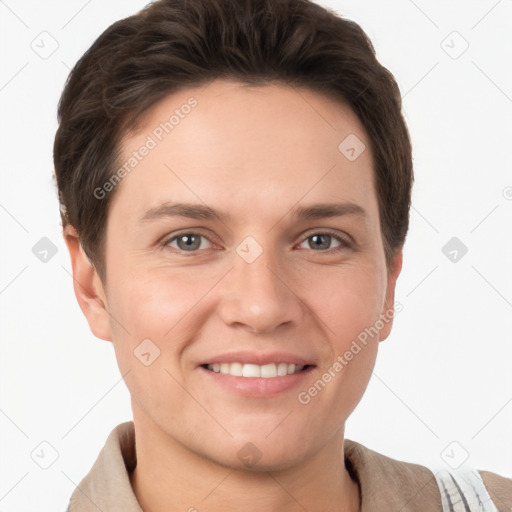 Joyful white young-adult female with short  brown hair and grey eyes