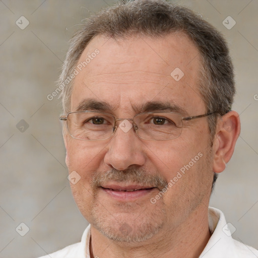 Joyful white middle-aged male with short  brown hair and brown eyes