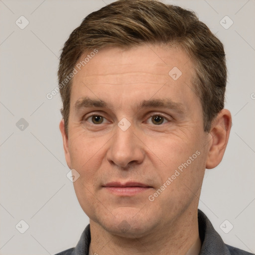 Joyful white adult male with short  brown hair and grey eyes