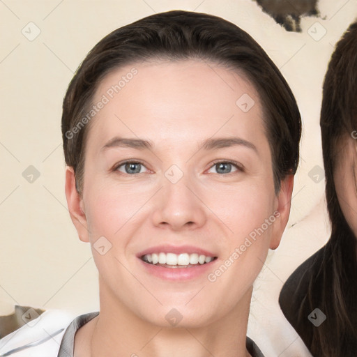 Joyful white young-adult female with short  brown hair and brown eyes