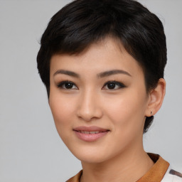 Joyful asian young-adult female with short  black hair and brown eyes