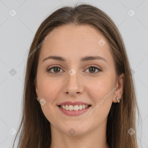 Joyful white young-adult female with long  brown hair and grey eyes