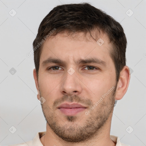 Neutral white young-adult male with short  brown hair and brown eyes