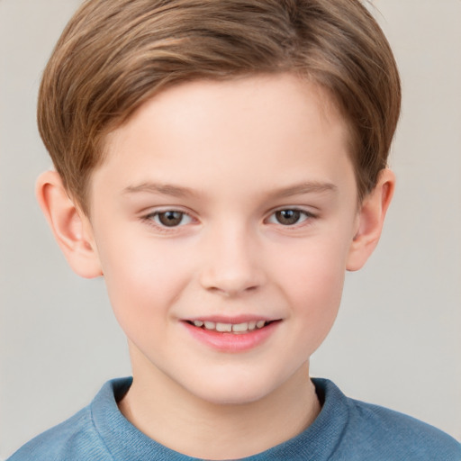 Joyful white child male with short  brown hair and grey eyes