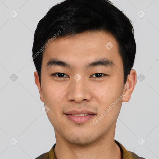 Joyful asian young-adult male with short  black hair and brown eyes