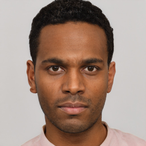 Neutral black young-adult male with short  black hair and brown eyes
