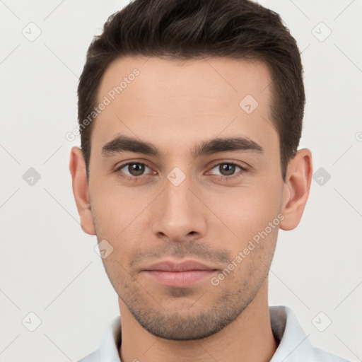 Neutral white young-adult male with short  brown hair and brown eyes