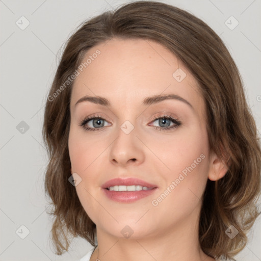 Joyful white young-adult female with medium  brown hair and green eyes