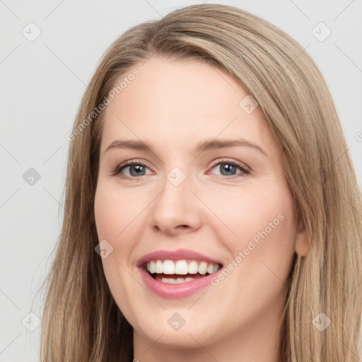 Joyful white young-adult female with long  brown hair and grey eyes