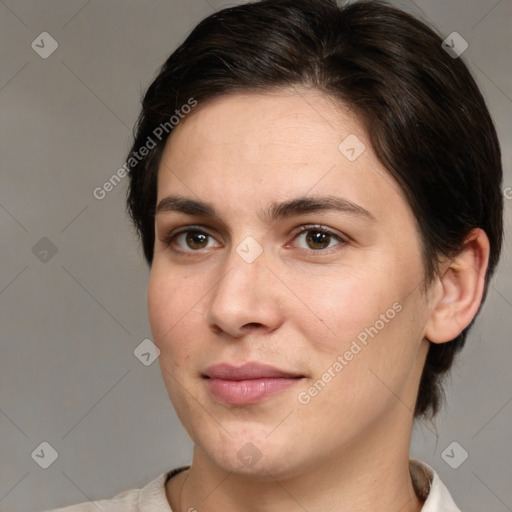 Joyful white adult female with medium  brown hair and brown eyes