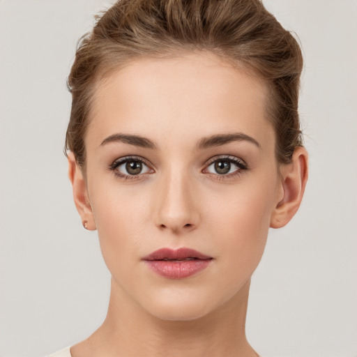 Neutral white young-adult female with short  brown hair and brown eyes