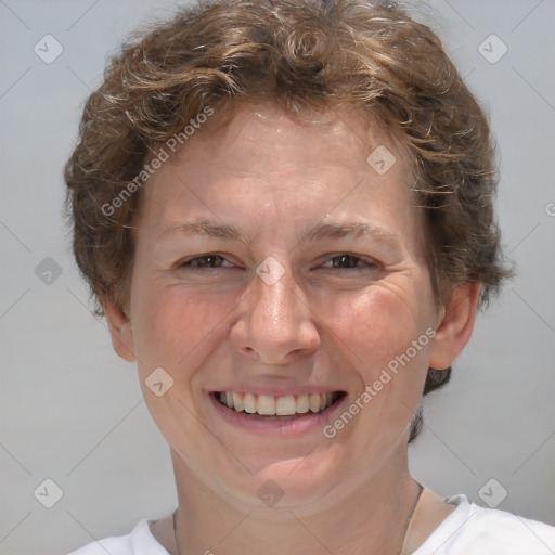 Joyful white adult female with short  brown hair and brown eyes