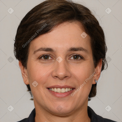 Joyful white adult female with medium  brown hair and brown eyes