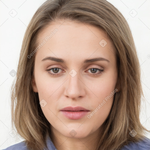 Neutral white young-adult female with long  brown hair and brown eyes