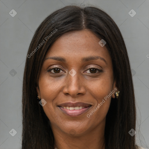 Joyful black young-adult female with long  brown hair and brown eyes